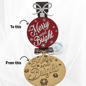 A wall or door hanger shaped like a big Christmas ornament, featuring the festive words of "Merry and Bright". Finished product is for inspiration only as this is a DIY project.