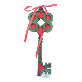 Santa Key that is for Christmas decor. Laser cut from wood, two layers to make it appear thick. Comes painted red and green and the two layers glued together with a red ribbon. 