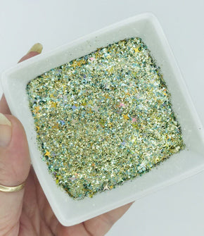 Kaleidoscope is a gold with holographic 4 point stars glitter