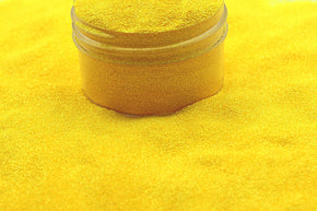 A bright yellow glitter that shimmers instead of sparkles